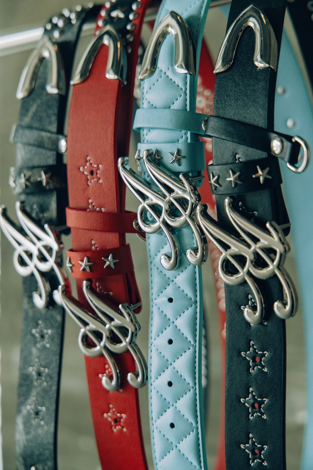 Ad Astra studded western belts with script AA buckles in black, cherry red and baby blue